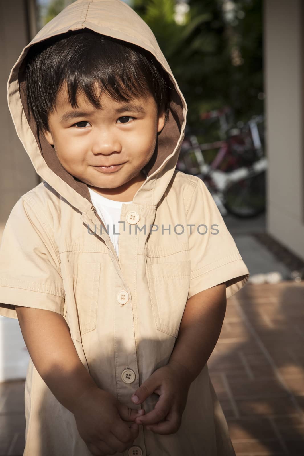young children wearing hood sweat with lovely face standing at h by khunaspix