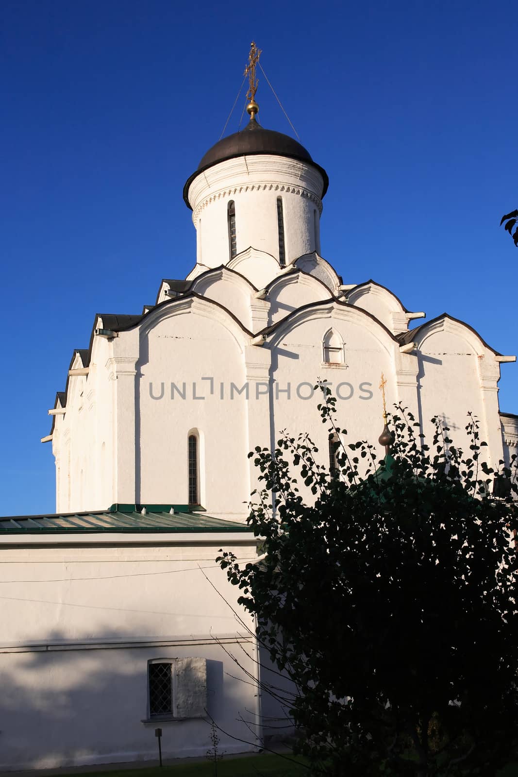 View of nice ancient Russian monastery against blue sky, city of Vladimir