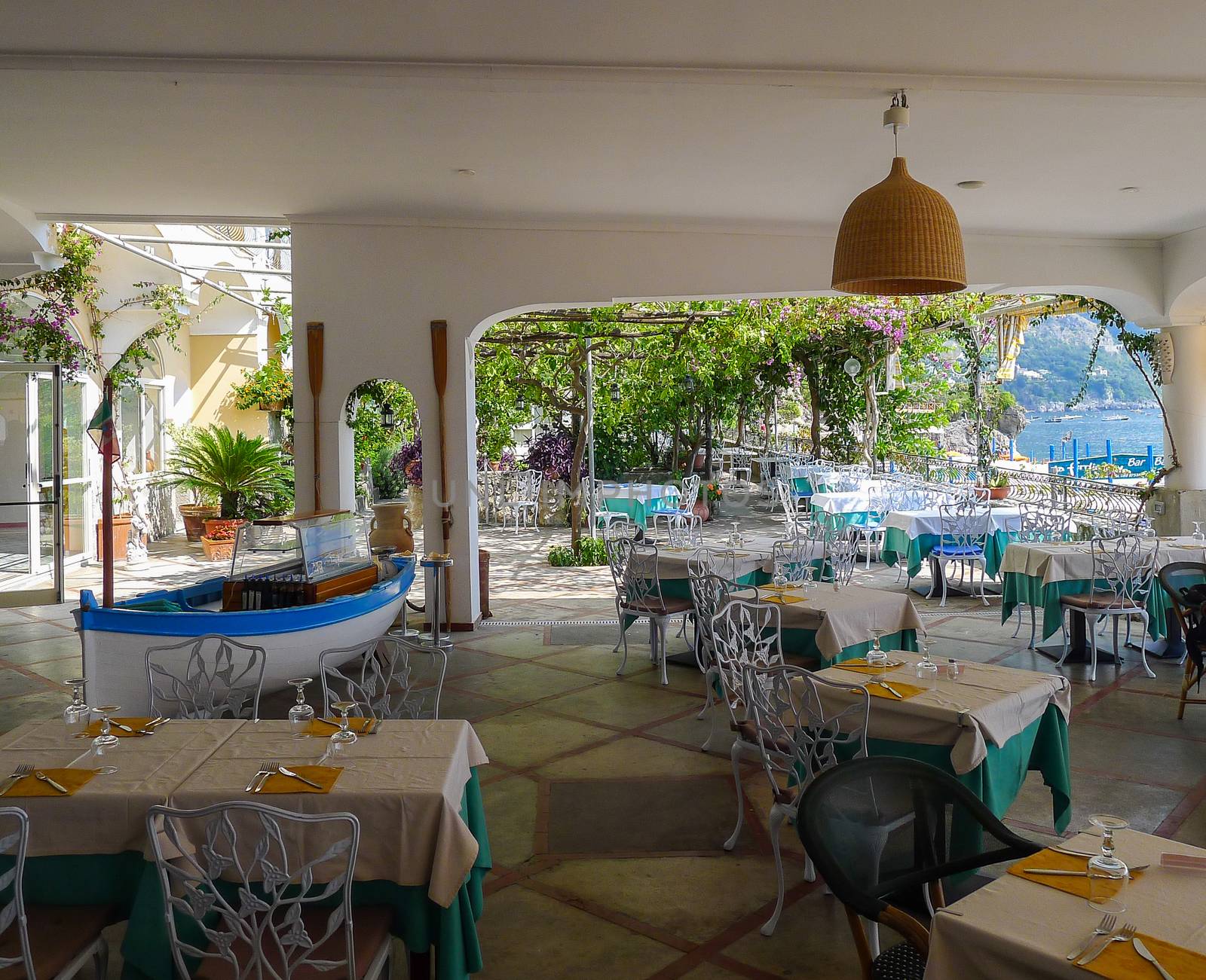 Beach front restaurant on the Amalfi coast with an interesting boat in the main restaurant itself