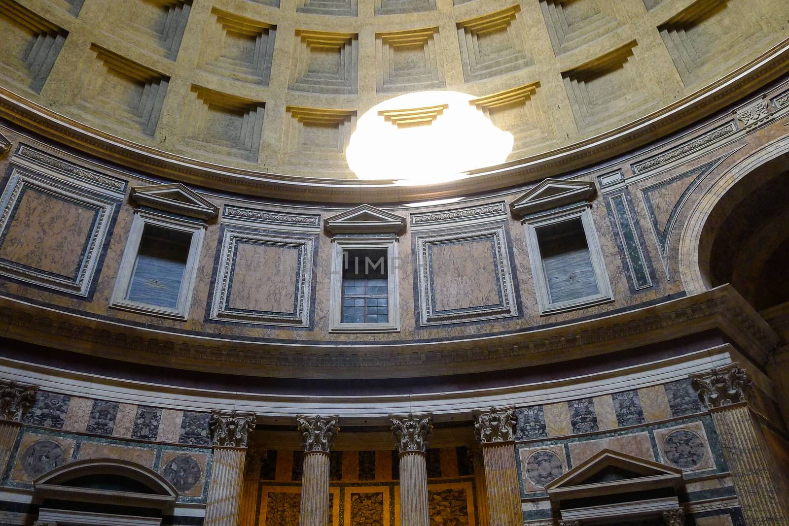 The Pantheon is a former Roman temple, now a church, in Rome, Italy, on the site of an earlier temple commissioned by Marcus Agrippa during the reign of Augustus (27 BC – 14 AD). The present building was completed by the emperor Hadrian and probably dedicated about 126 AD.