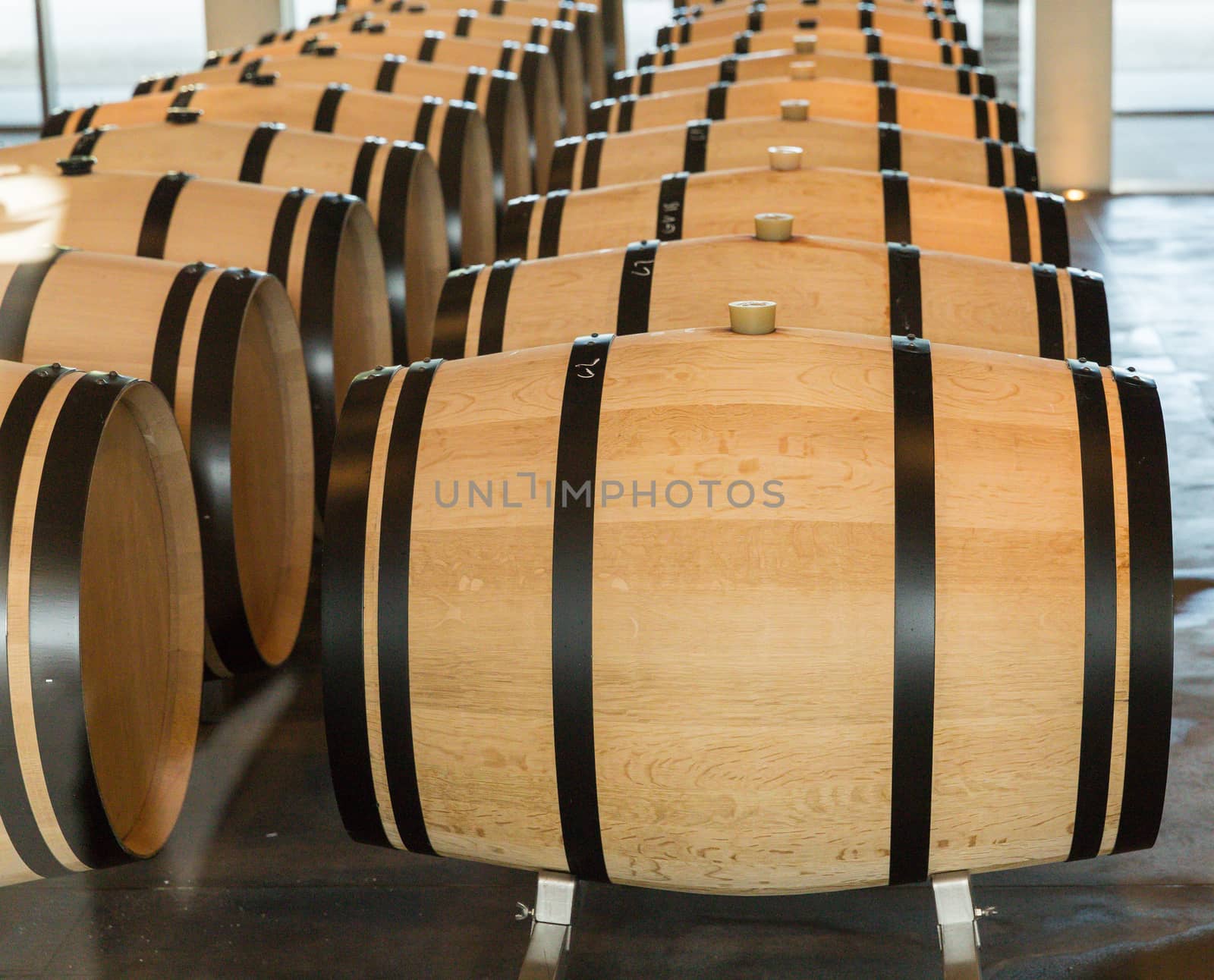 Wine barrels, especially those made of oak, have long been used as containers in which wine is aged. Aging in oak typically imparts desirable vanilla, butter and spice flavors to wine. The size of the barrel plays a large role in determining the effects of oak on the wine by dictating the ratio of surface area to volume of wine with smaller containers having a larger impact. The most common barrels are the Bordeaux barriques style which hold 225 litres (59 US gal)