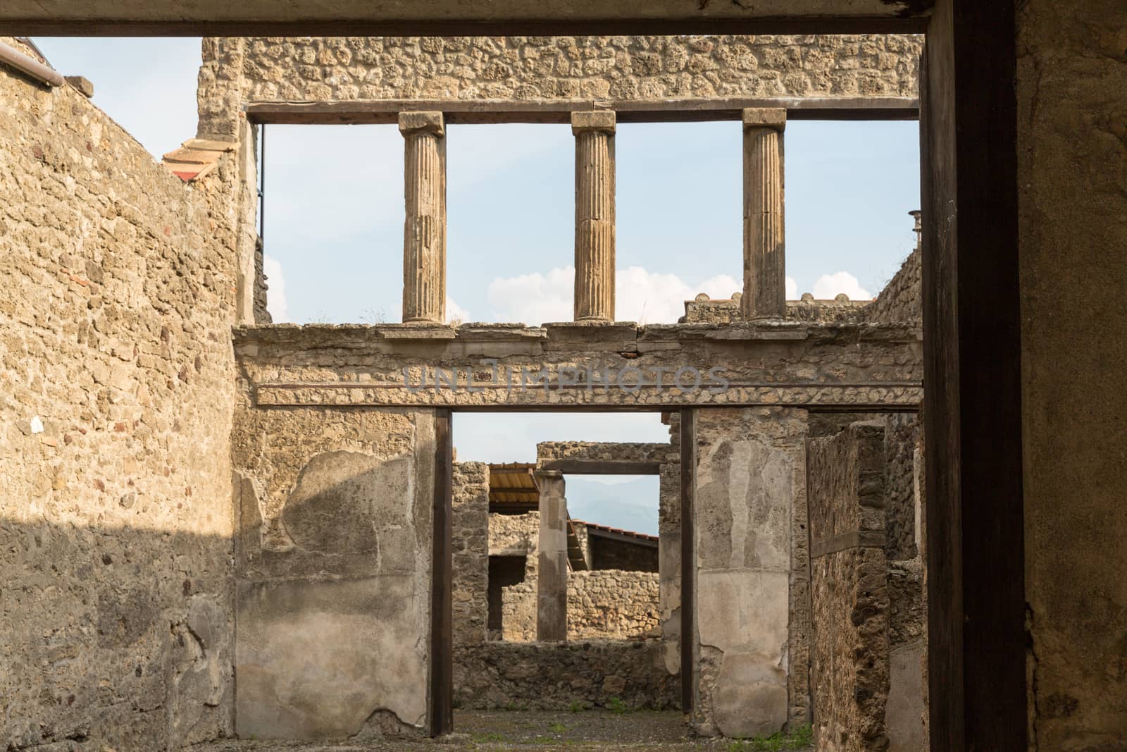 Pompeii was an ancient Roman town-city near modern Naples, in the Campania region of Italy, in the territory of the comune of Pompei. Pompeii, along with Herculaneum and many villas in the surrounding area, was mostly destroyed and buried under 4 to 6 m (13 to 20 ft) of volcanic ash and pumice in the eruption of Mount Vesuvius in 79 AD.