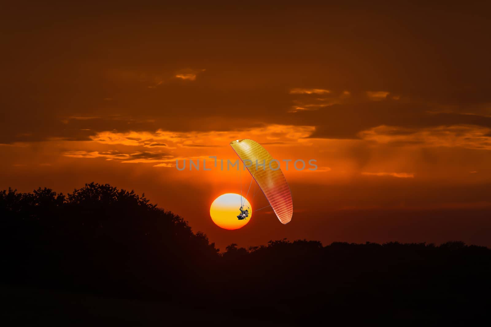 Silhouette paramotor before bloody sunset by JFsPic