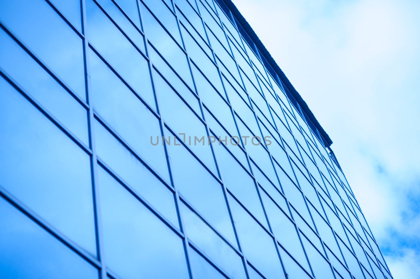 glass office building on a background of the sky.