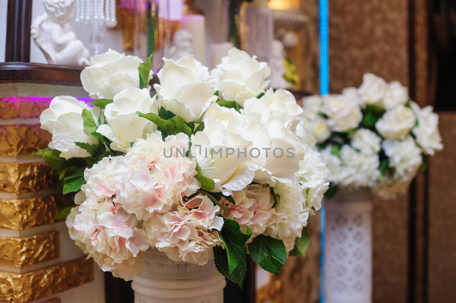 wedding bouquet of white roses. Decor in the restaurant.