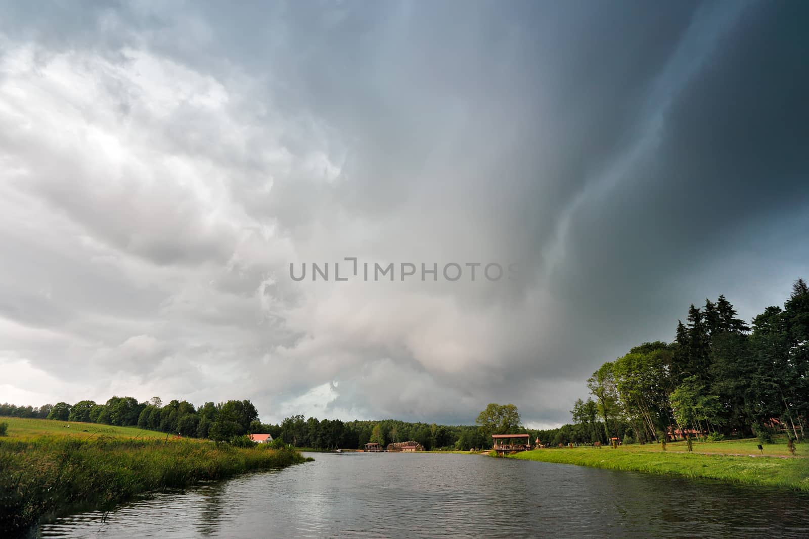 Summer storm landscape. Dramatic cloudy sky. Hurricane and rain in Belarus