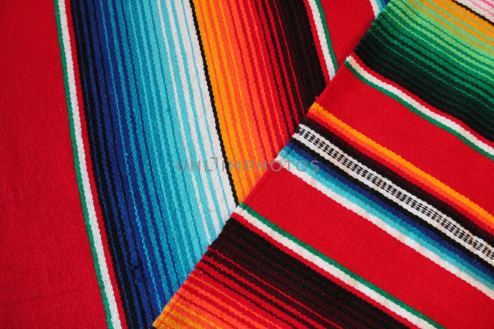 Mexico traditional cinco de mayo rug poncho fiesta background with stripes copy space