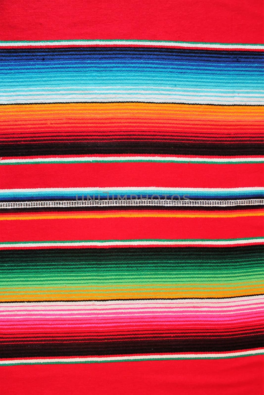 Mexico traditional cinco de mayo rug poncho fiesta background with stripes copy space