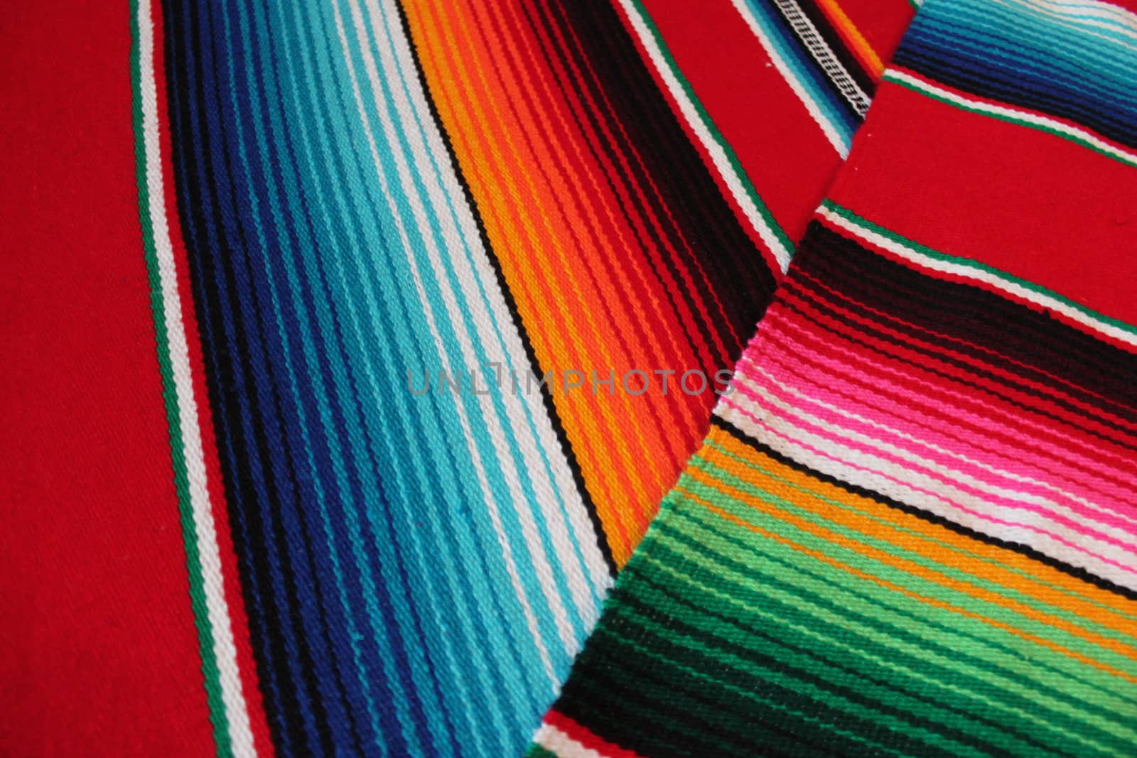 Mexico traditional cinco de mayo rug poncho fiesta background with stripes copy space