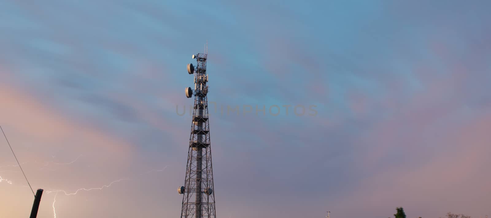 Radio tower in Queensland during a lightning storm. by artistrobd