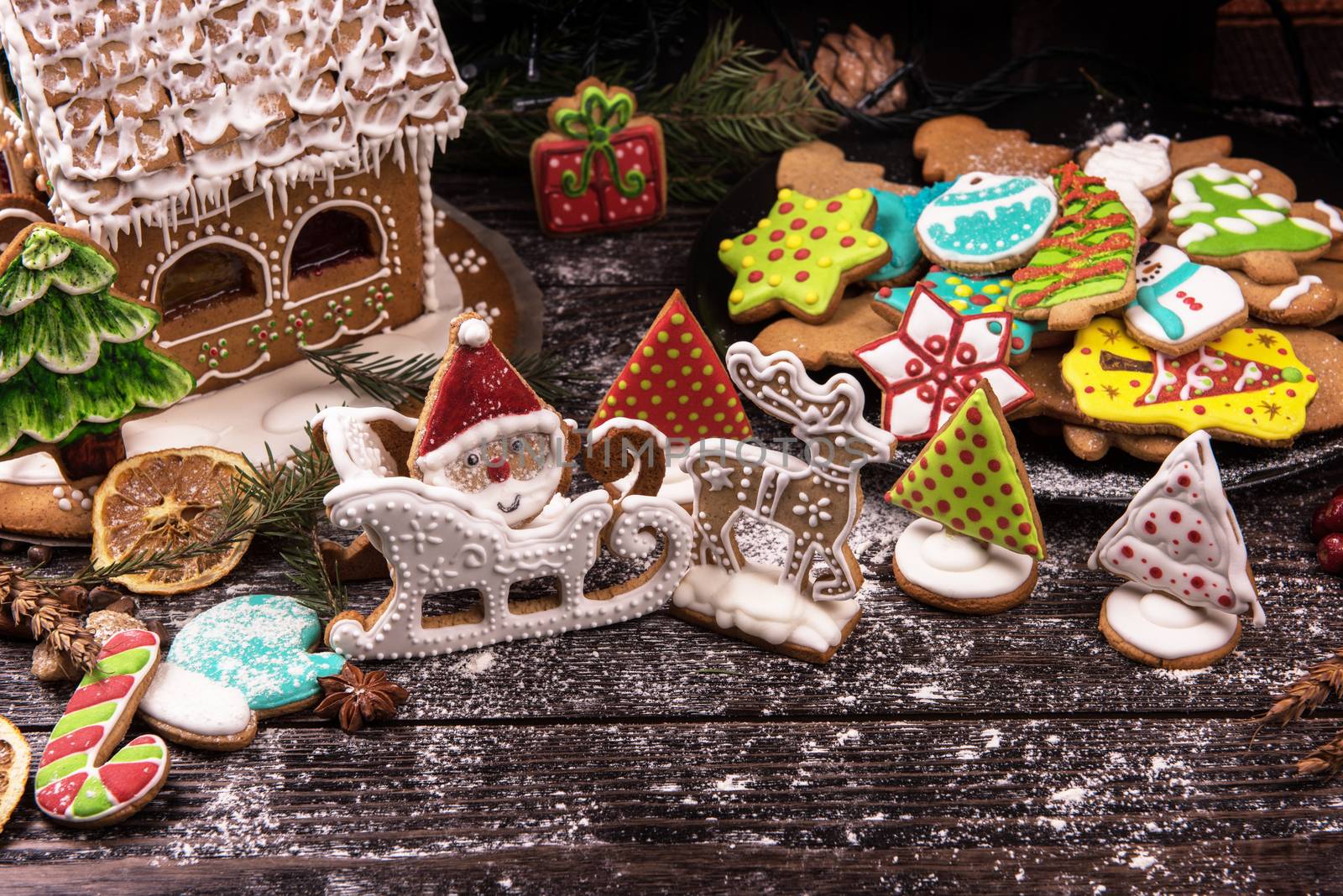 Different ginger cookies for new years and christmas on wooden background