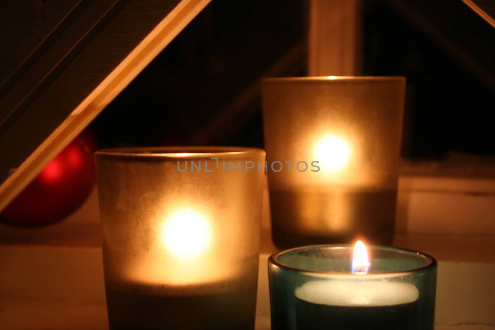 three burning candlelights