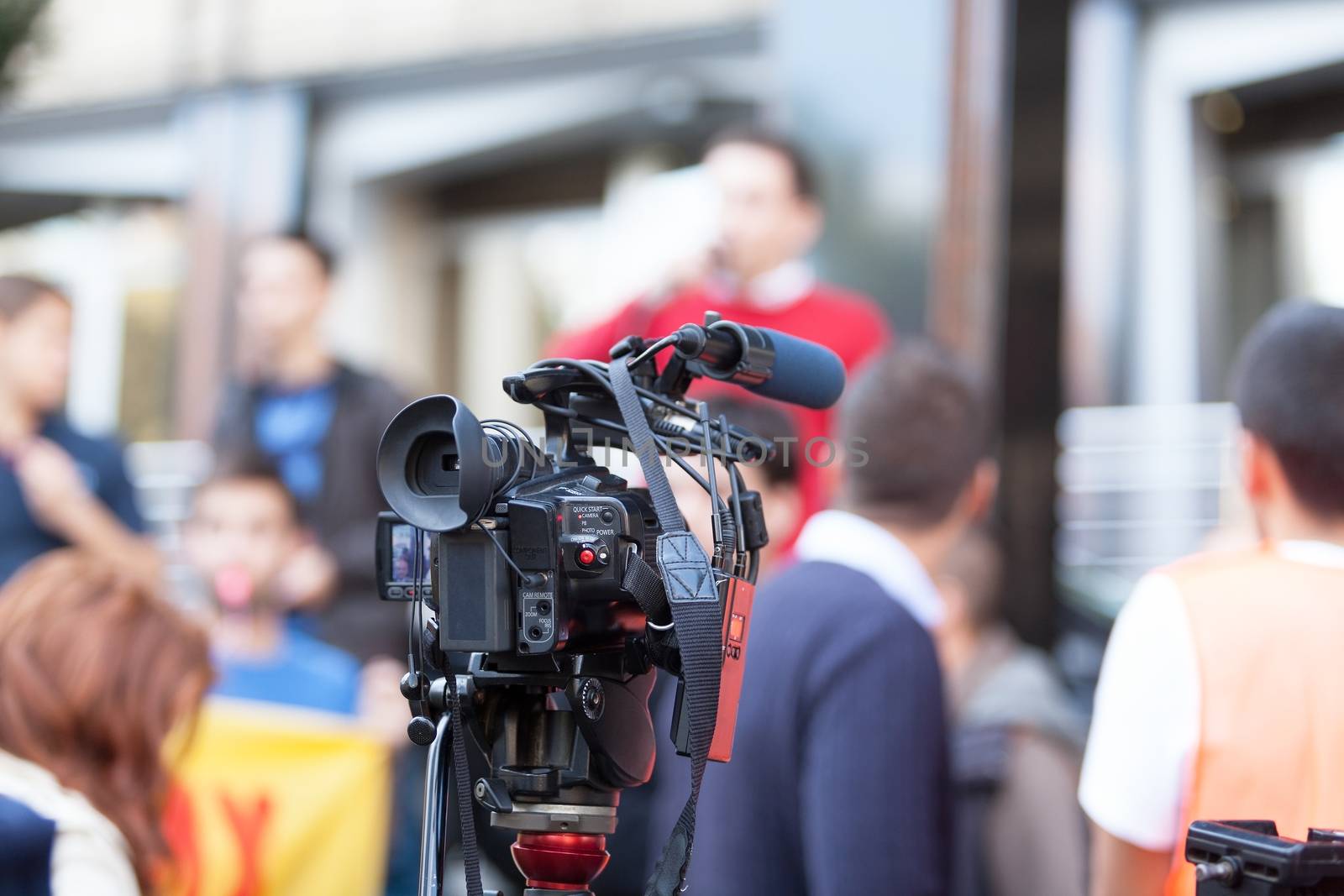 Filming street protest using video camera