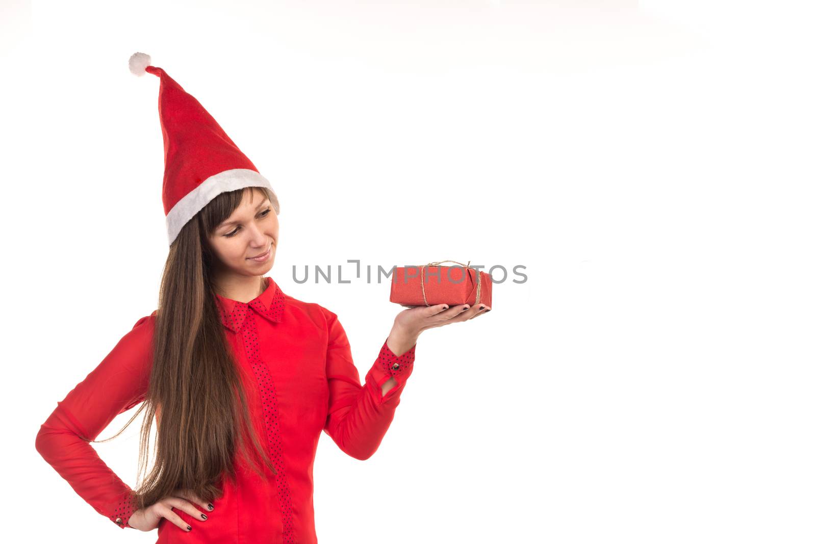 Young long-haired woman in red christmas cap and red gift box
