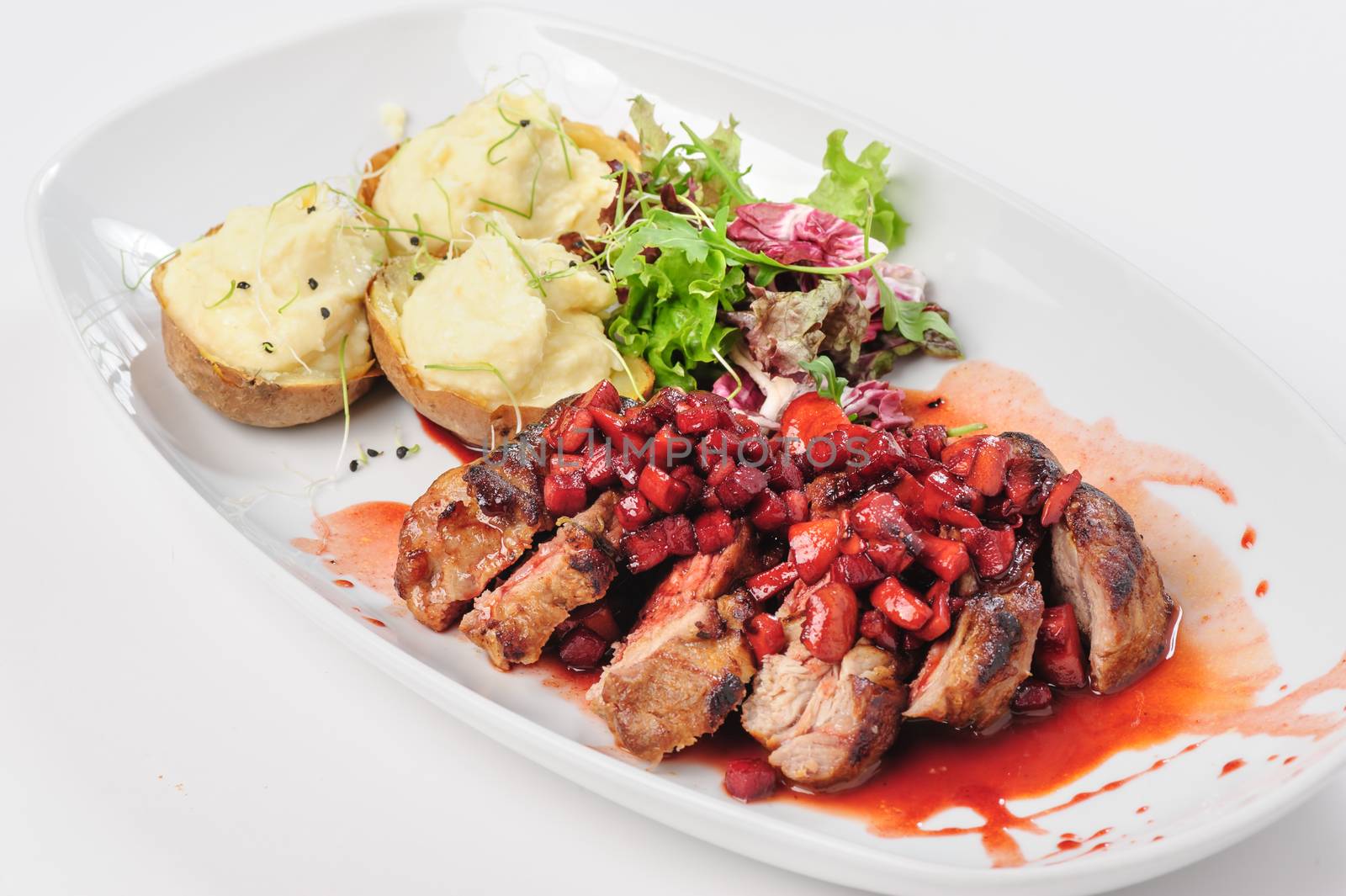 roasted beef slices with berry, apple and pear sauce, potatoes and green salad