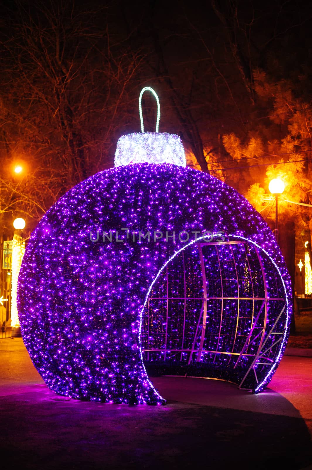 big gazebo in form of Christmas balls in winter park