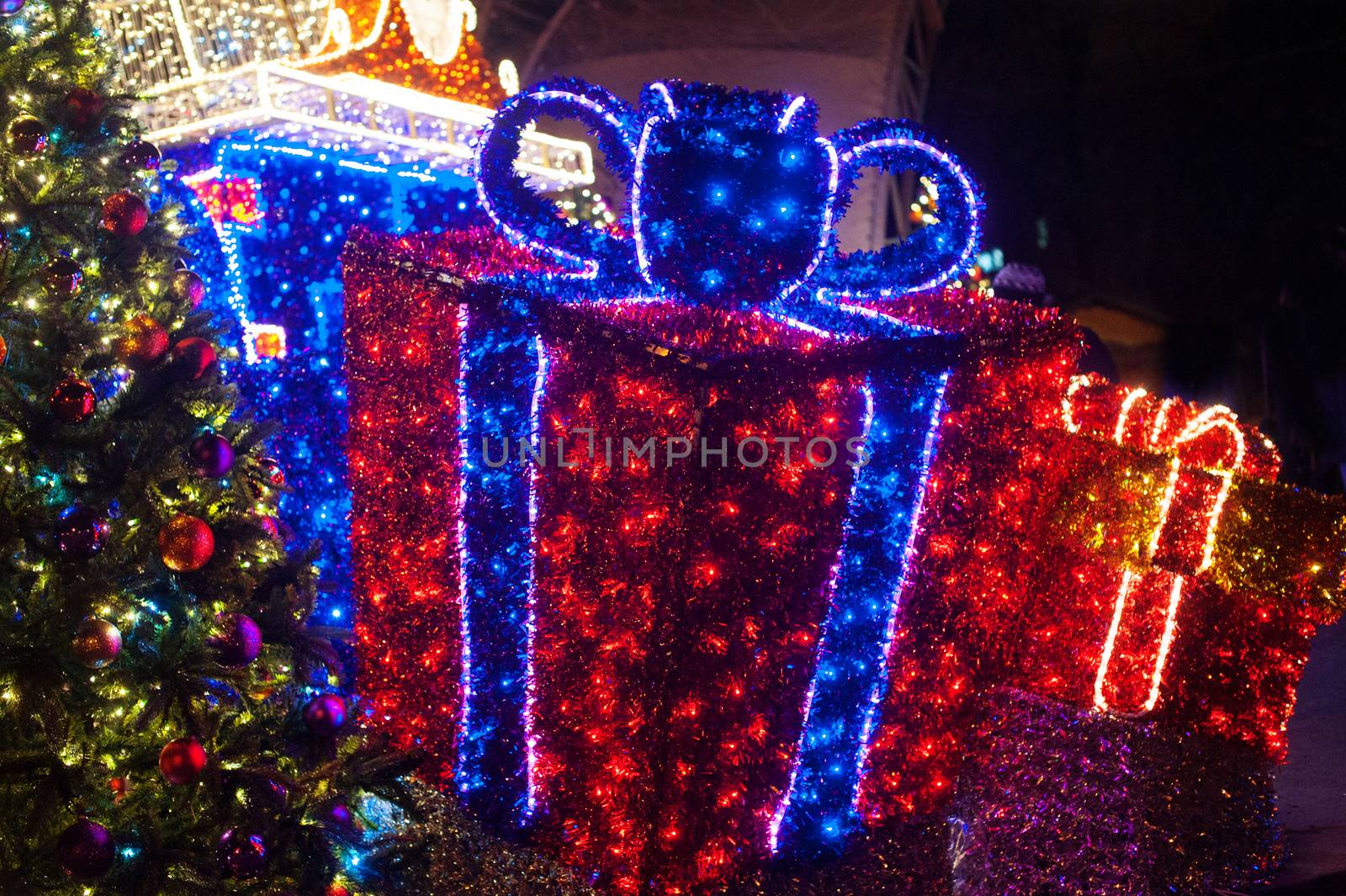 decor on theme of Christmas. illumination gifts and fir tree.