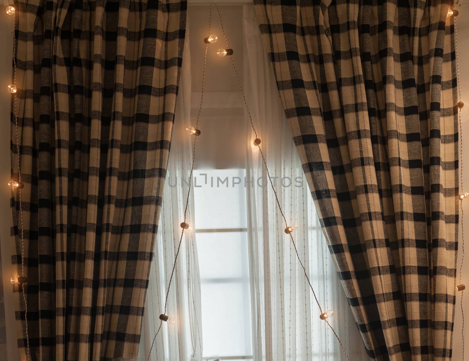 Brown curtains with garlands for Christmas holiday