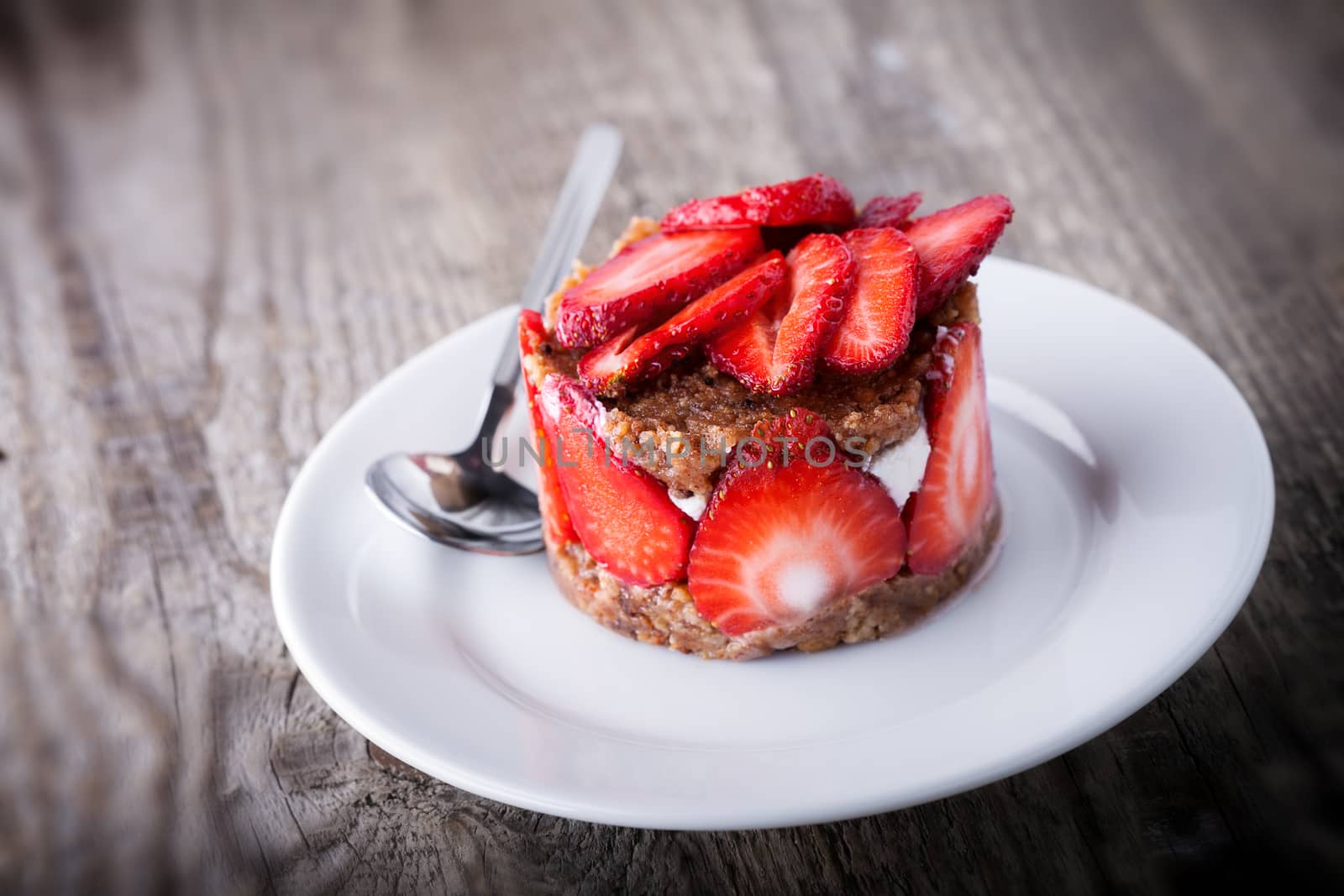 Strawberry and custard tart on a white plate by supercat67