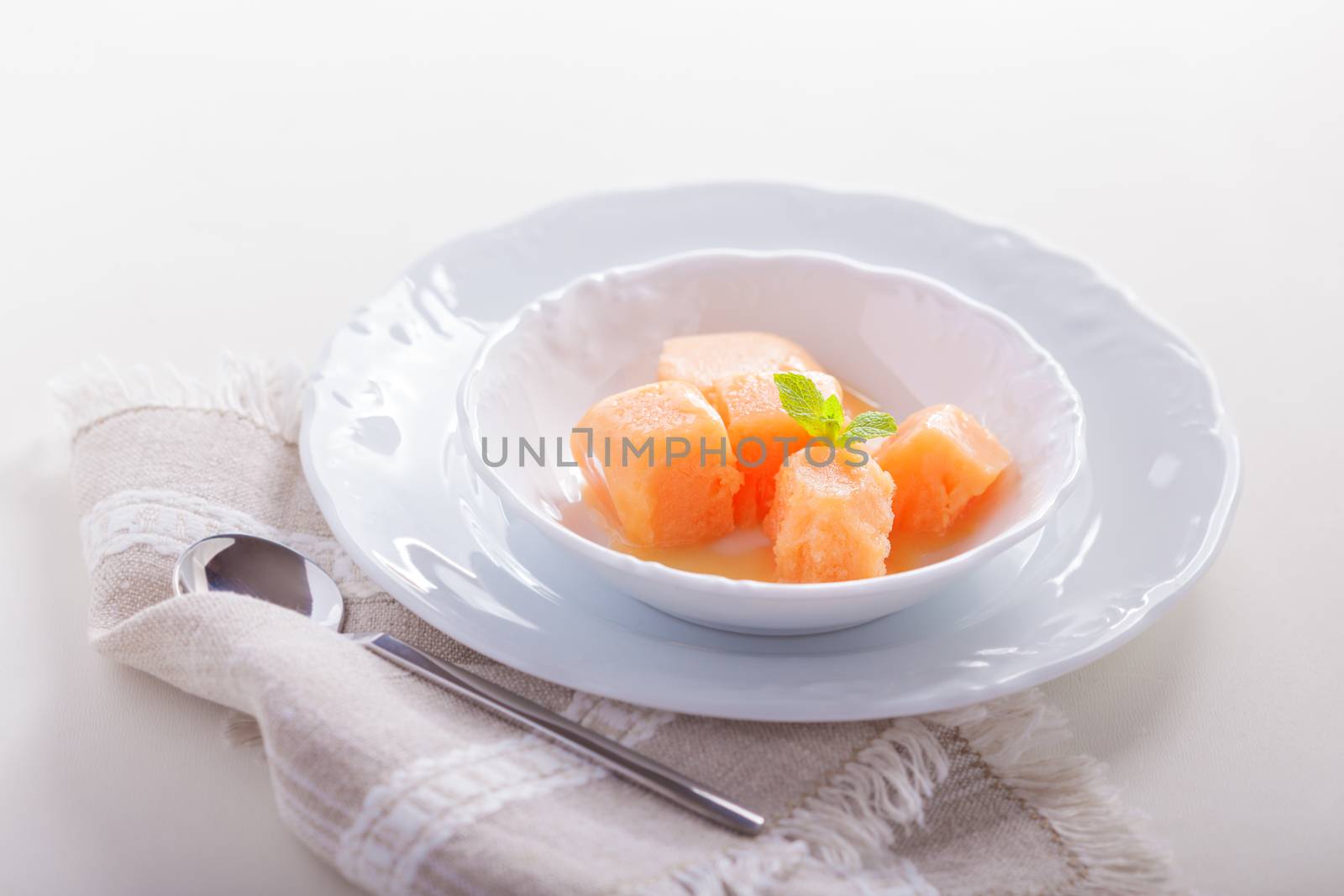 Apricot sorbet, natural sweet on a white plate
