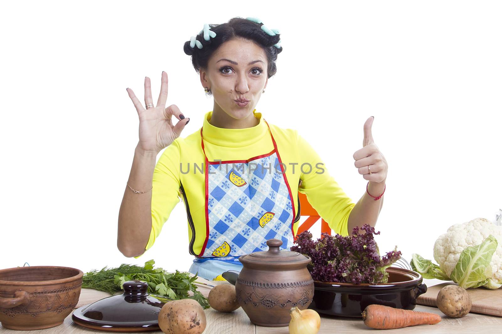 Housewife is preparing in the kitchen on a white background