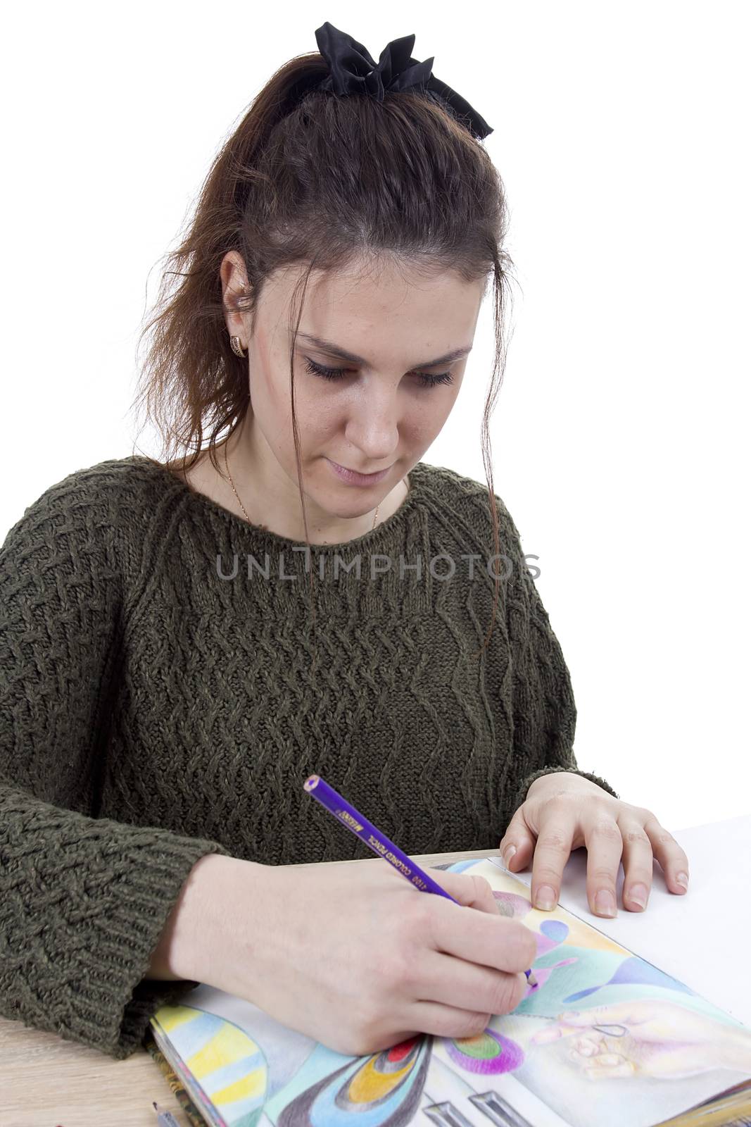 Young girl artist drawing pencils on white background