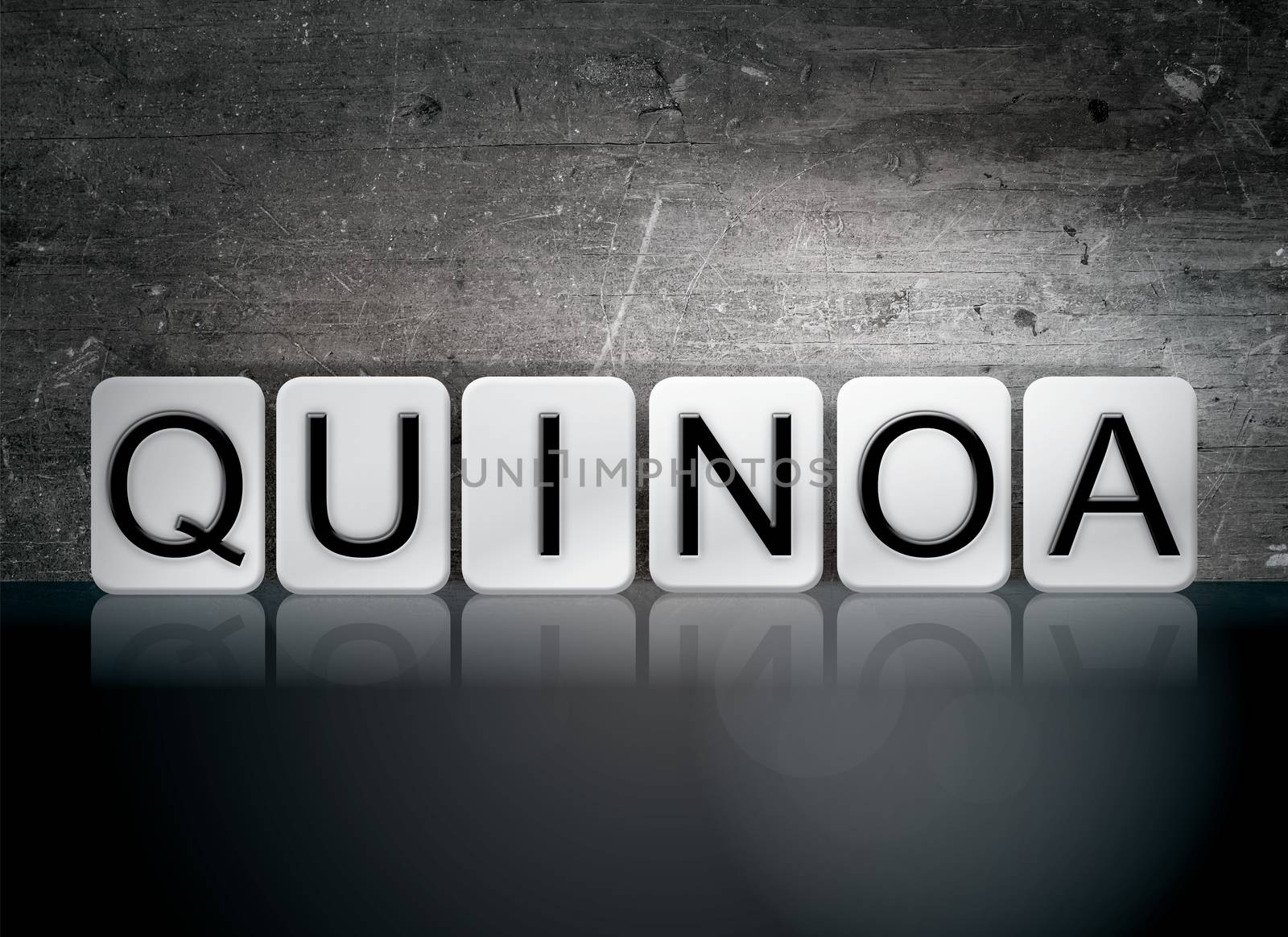 The word "Quinoa" written in white tiles against a dark vintage grunge background.