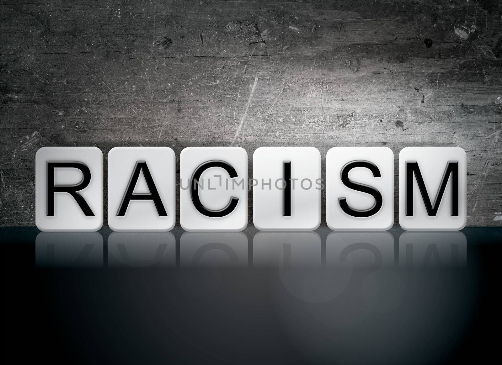 The word "Racism" written in white tiles against a dark vintage grunge background.