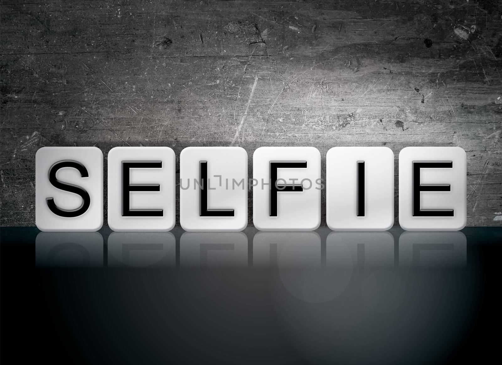 The word "Selfie" written in white tiles against a dark vintage grunge background.