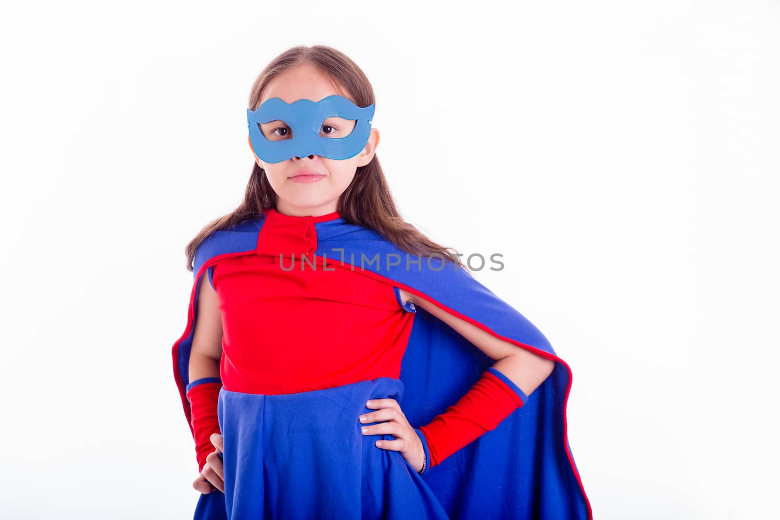 Girl in blue and red superhero costume with hands on hips