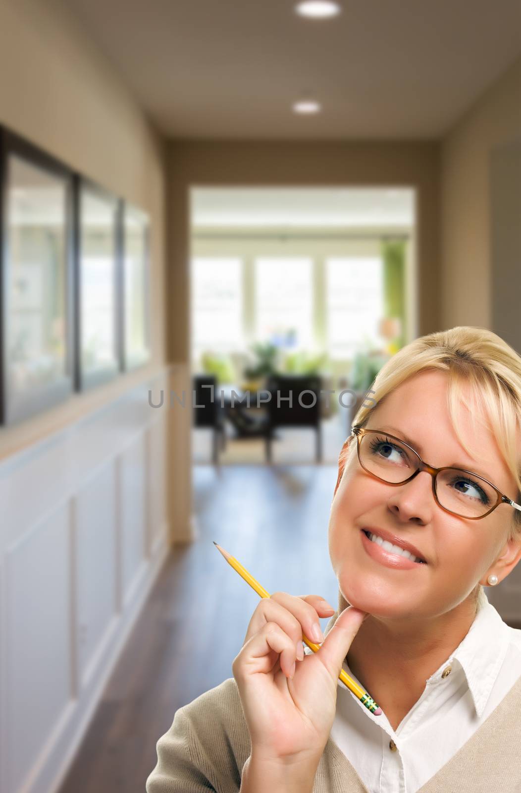 Woman with Pencil Inside the Hallway of New House.