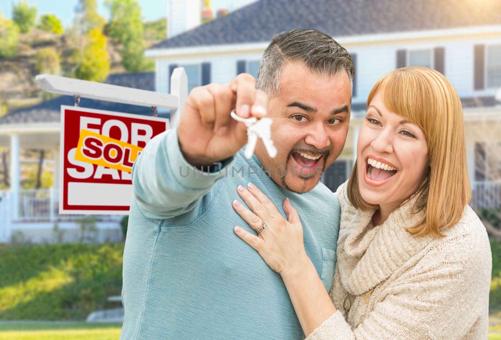 Mixed Race Couple With Keys in Front of Real Estate Sign and New by Feverpitched