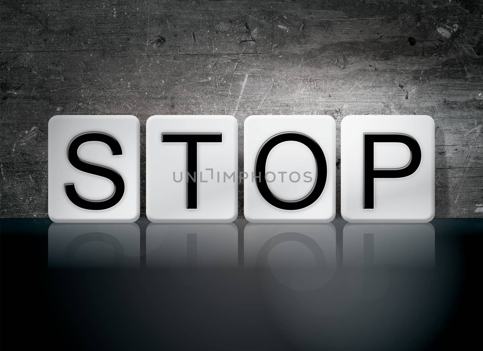 The word "Stop" written in white tiles against a dark vintage grunge background.