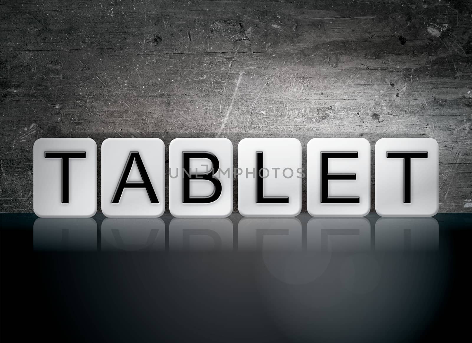 The word "Tablet" written in white tiles against a dark vintage grunge background.