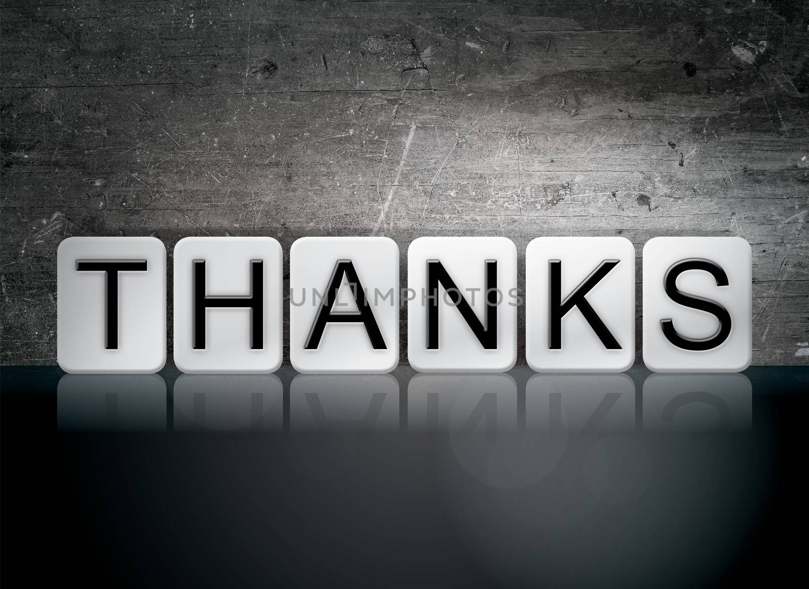 The word "Thanks" written in white tiles against a dark vintage grunge background.