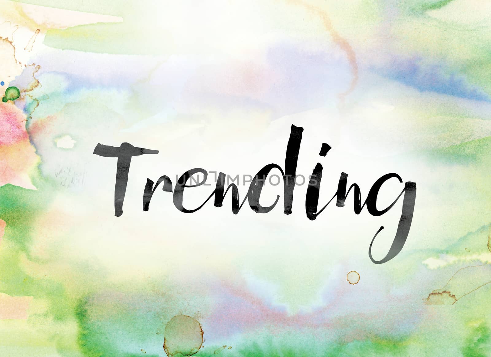 The word "Trending" painted in black ink over a colorful watercolor washed background concept and theme.