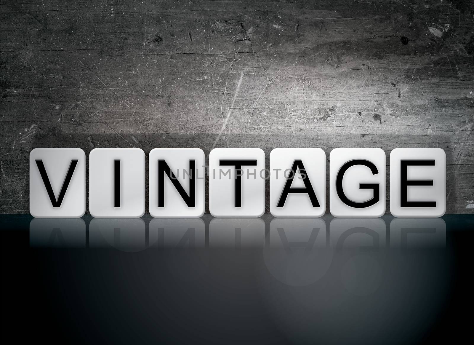 The word "Vintage" written in white tiles against a dark vintage grunge background.
