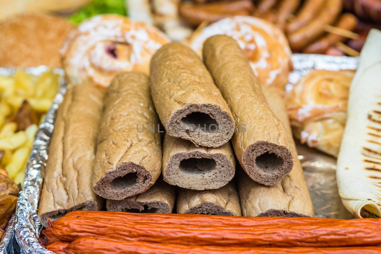 prepared buns for hot dogs with holes for sausages