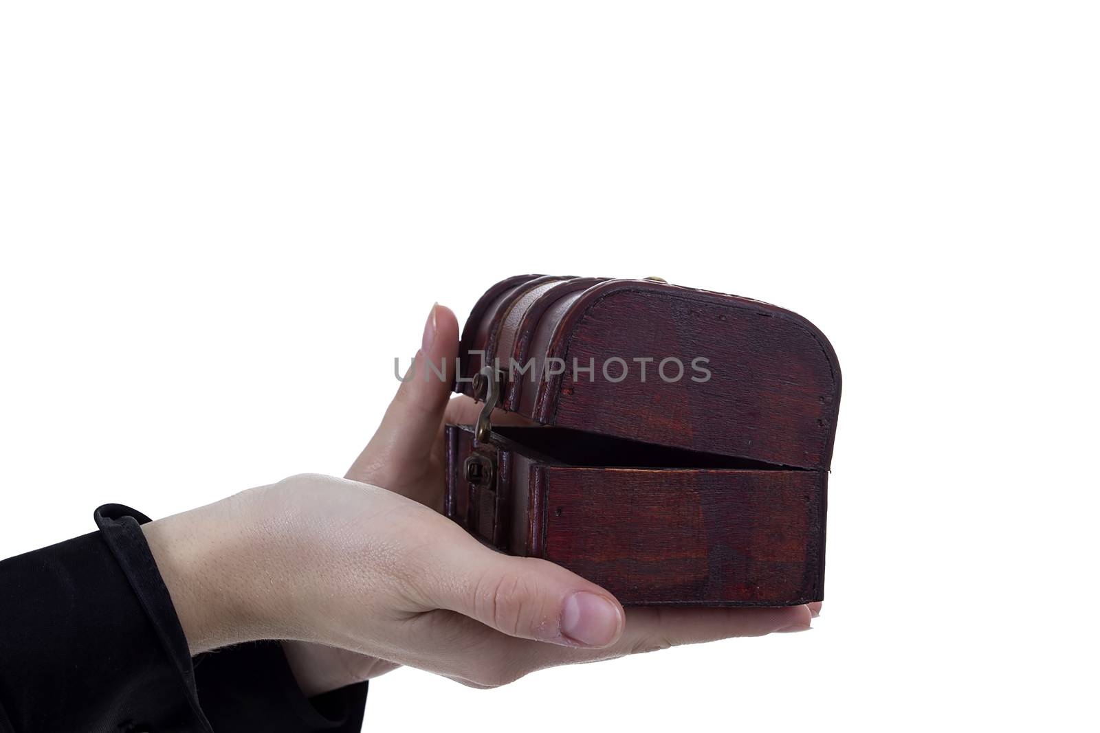 Antique casket in female hands on a white background