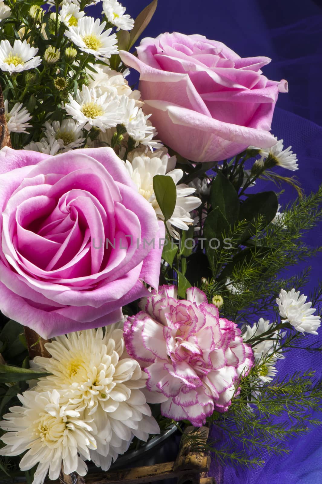 Elegant background with bouquet and purple fabric