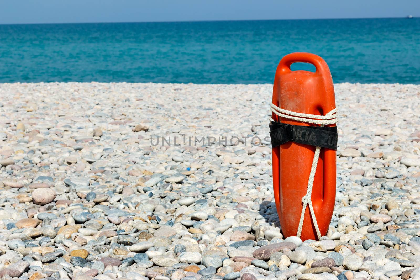 Red lifeguard float on the beach. Horizontal image.