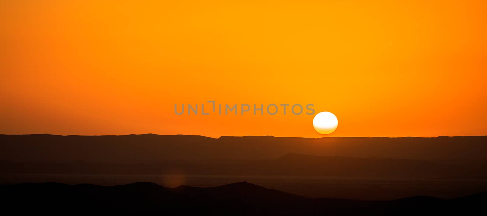 Beautiful sunset over the sand dunes in the Sahara desert, Morocco by pixinoo