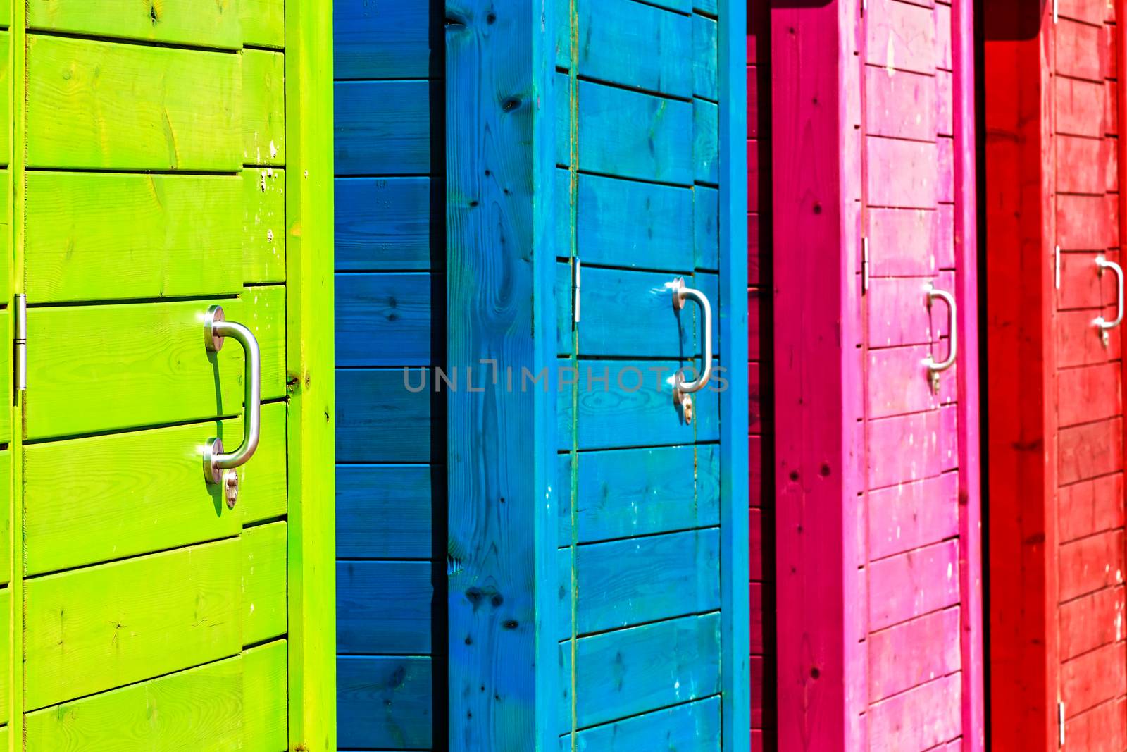 Beautiful colorful beach cabins closeup. Horizontal image.