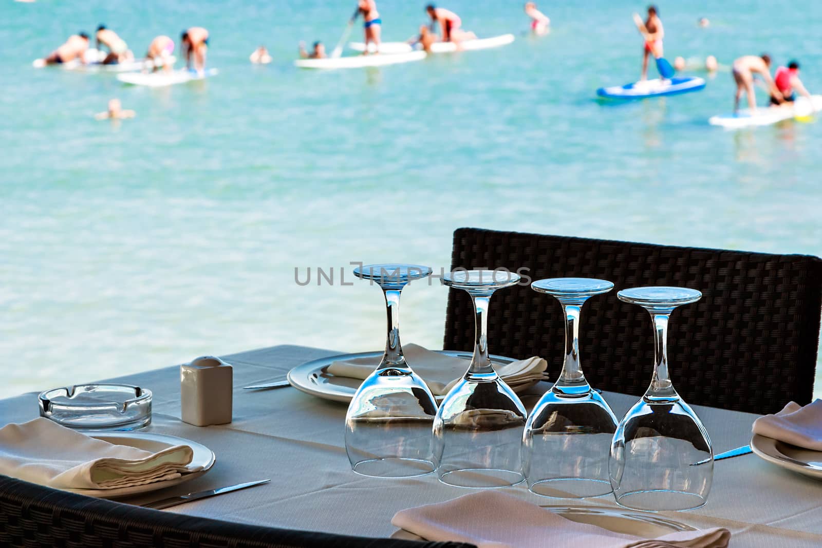 Restaurant on the seashore with the table set. Horizontal image.