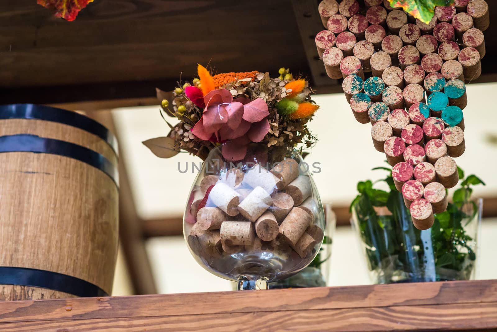 glass filled with wine corks by okskukuruza