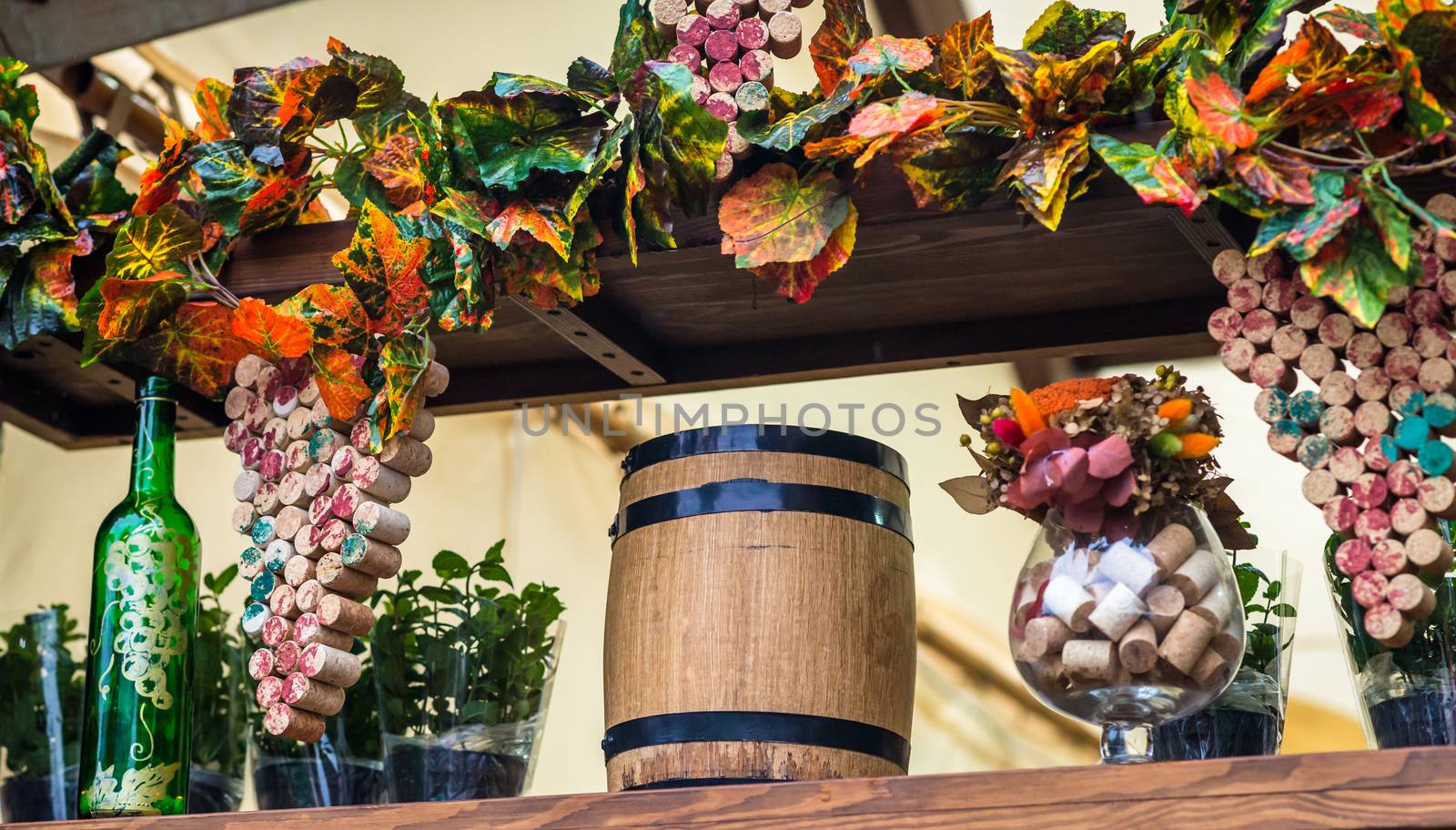 wooden barrel and grape leaves, still life