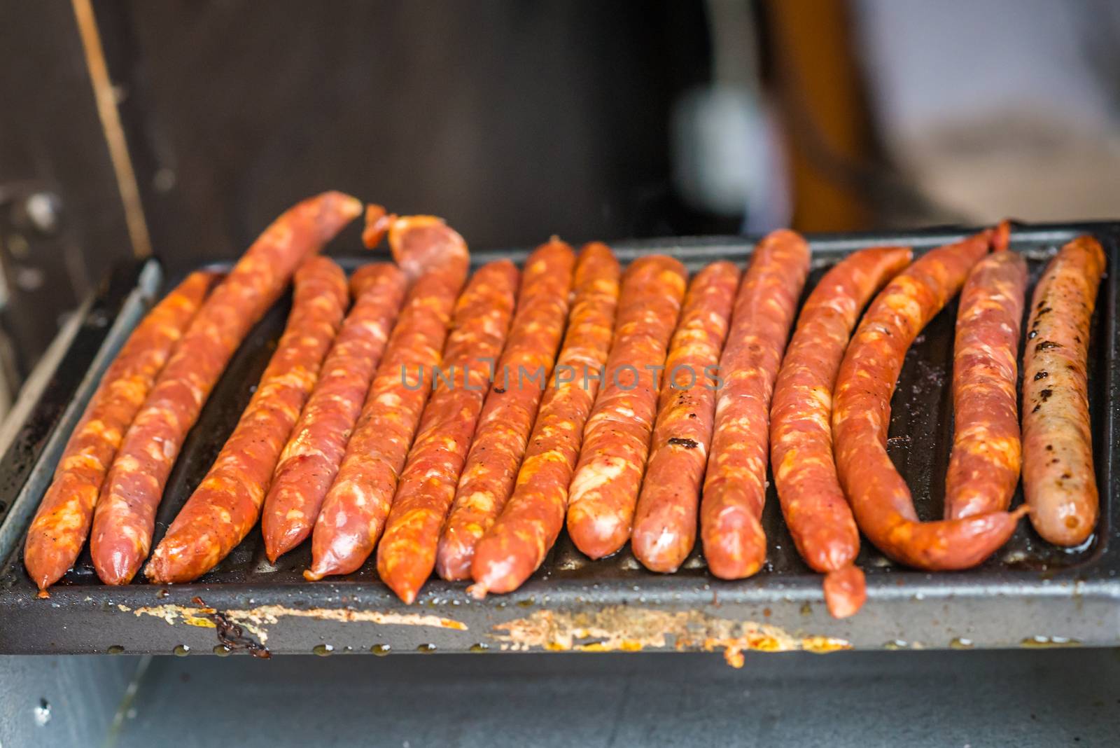 raw homemade sausages prepared on the grill