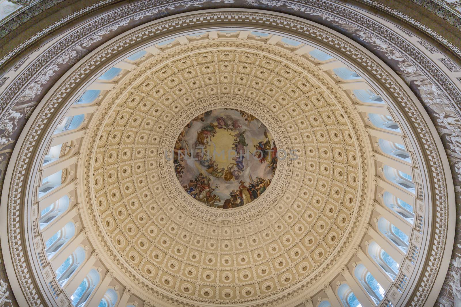 Looking up inside the Dome of the Capitol Building in Washington by chrisukphoto