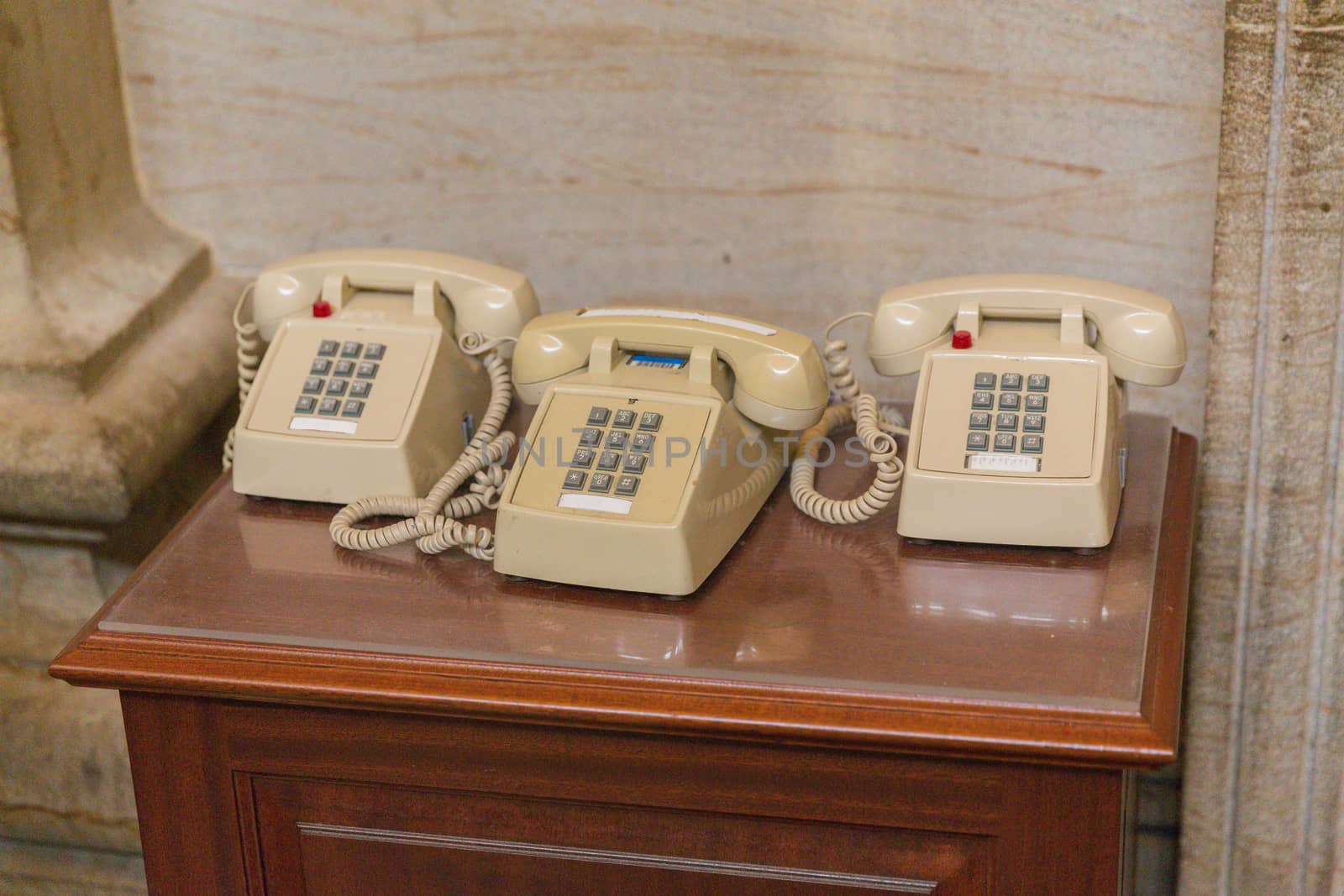 Old style classic amercian telephones - three of them on one desk