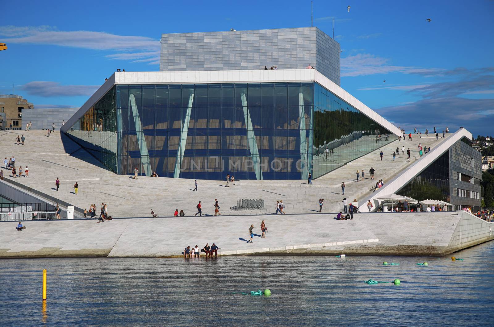 OSLO, NORWAY – AUGUST 17, 2016: Tourist on the Oslo Opera Hous by vladacanon